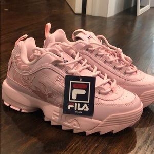 Pink Fila sneakers with rose design